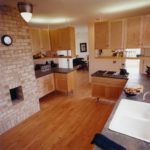 Kitchen view.  Warm materials balanced with concrete countertops